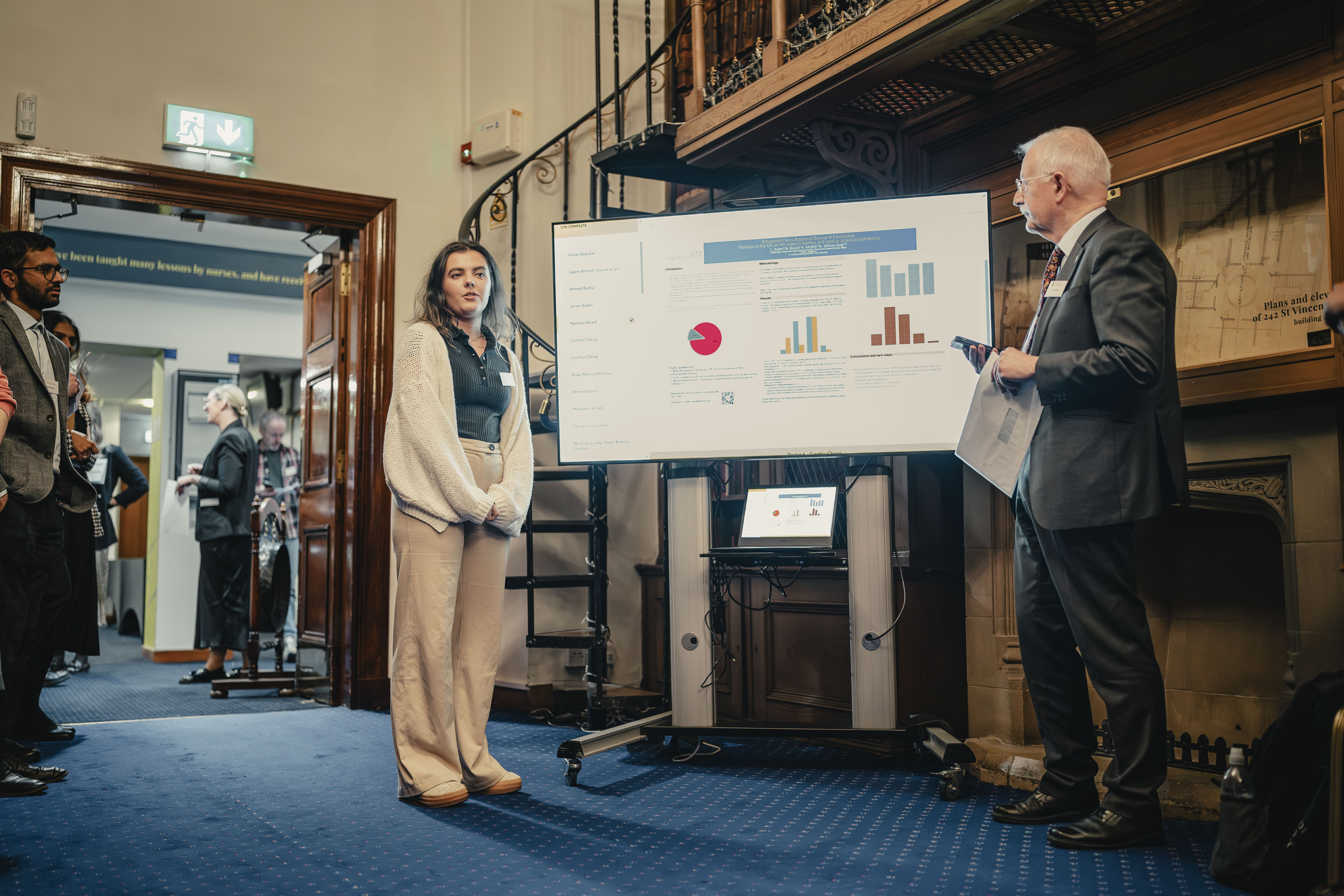 A person presenting their poster